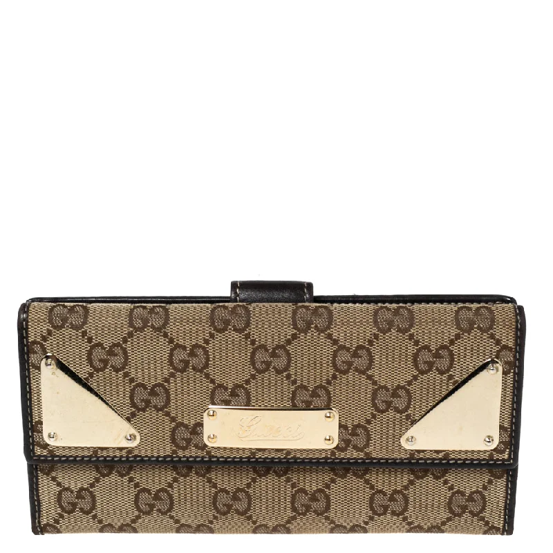 Women's money clip with a swarovski crystal accent​Gucci Dark Brown/beige Gg Canvas And Leather Indy Continental Wallet