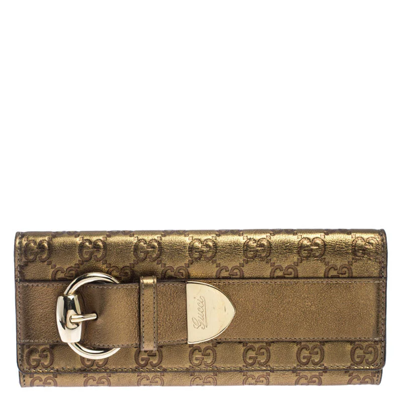 Women's money clip with a heart - shaped cutout​Gucci Gold Guccissima Leather Buckle Continental Wallet..