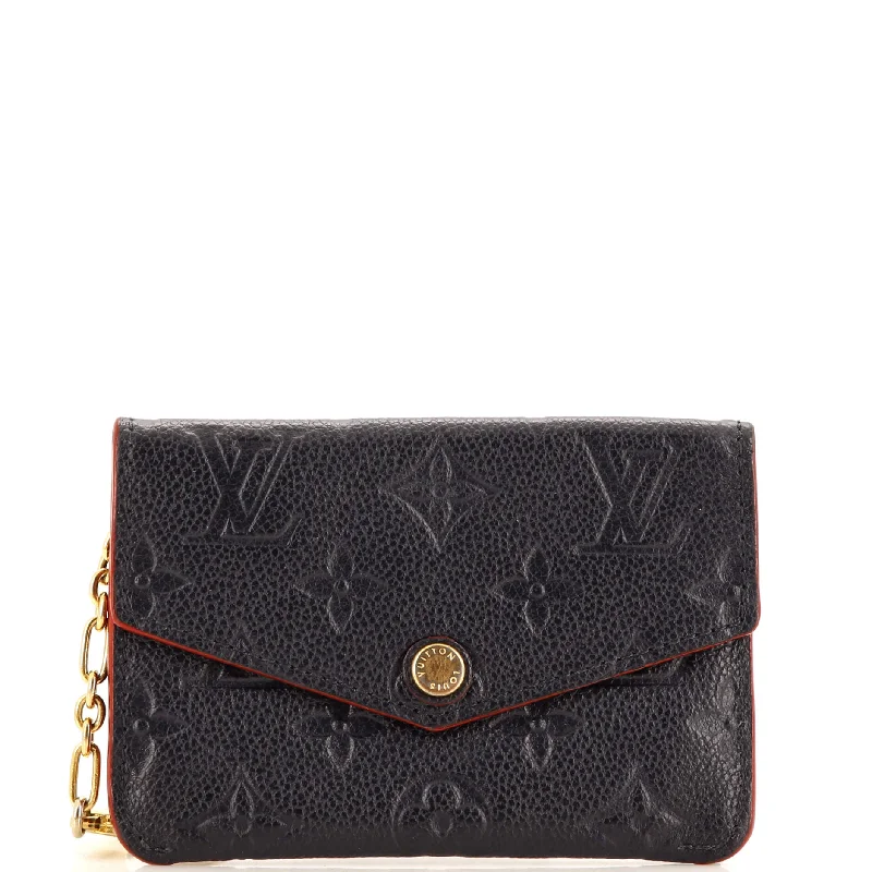 Women's money clip with a tassel for added flair​Key Pouch Monogram Empreinte Leather