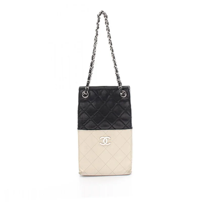 Metallic Tote Bag in Rose Gold with Chain Handles for a Glamorous Night OutBlack Chanel Bicolor Quilted Lambskin Vertical Shopping Tote Metallic Tote Bag in Rose Gold with Chain Handles for a Glamorous Night OutBlack Chanel Bicolor Quilted Lambskin Vertical Shopping Tote