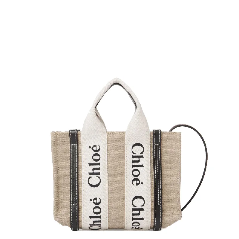 Monogrammed Tote Bag in Brown Leather with Personalized Initials for a Custom and Elegant TouchWoody Tote Mini Strap Linen, Full Blue Monogrammed Tote Bag in Brown Leather with Personalized Initials for a Custom and Elegant TouchWoody Tote Mini Strap Linen, Full Blue