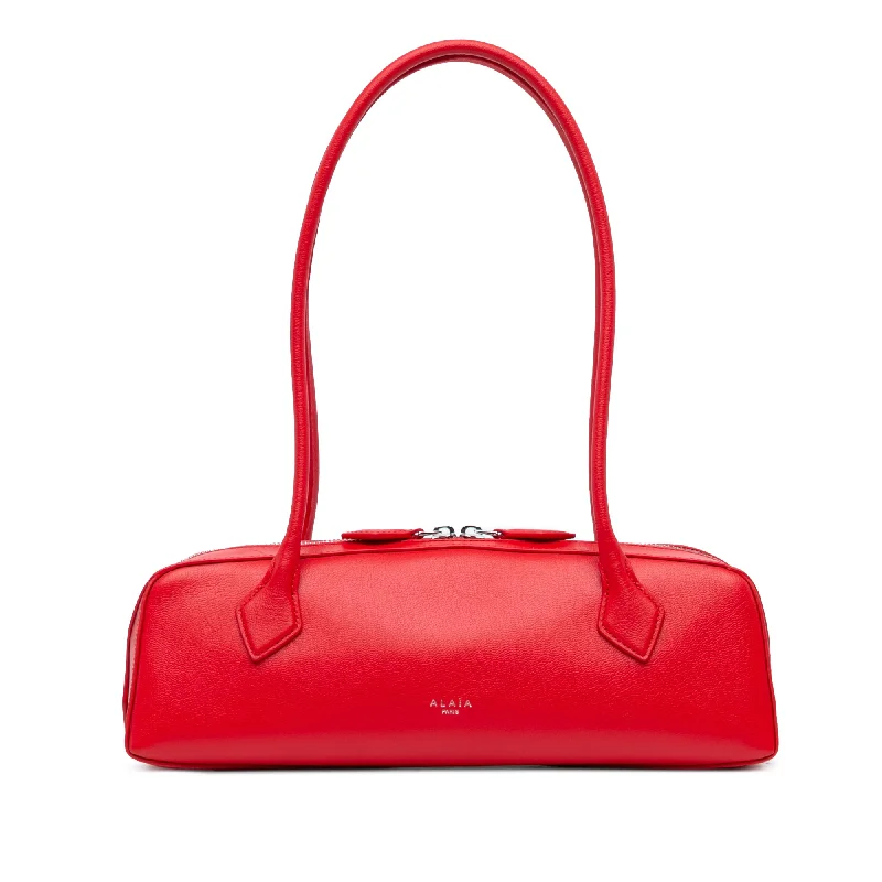 Pvc Shoulder Bag in Clear with Glitter for a Fun and Modern LookRed ALAÏA Medium Goatskin Le Teckel Shoulder Bag Pvc Shoulder Bag in Clear with Glitter for a Fun and Modern LookRed ALAÏA Medium Goatskin Le Teckel Shoulder Bag